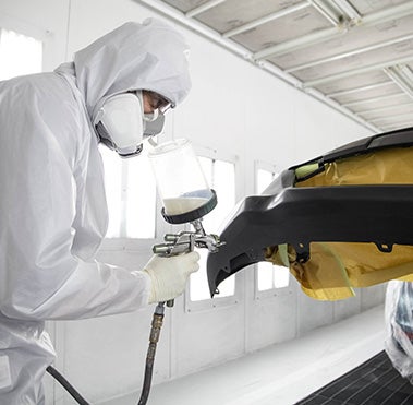 Collision Center Technician Painting a Vehicle | Baierl Toyota in Mars PA