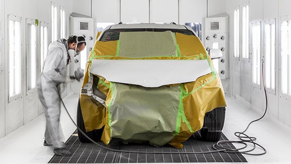 Collision Center Technician Painting a Vehicle | Baierl Toyota in Mars PA